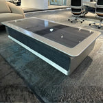 Load image into Gallery viewer, Luxury modern executive coffee table with a sleek silver metallic frame and dark glossy glass top 140 x 70 x 45 cm