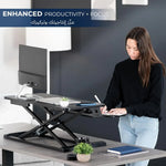 Load image into Gallery viewer, NEWSTAR 32 inch Desk Converter, K Series, Height Adjustable Sit to Stand Riser, Dual Monitor and Laptop Workstation with Wide Keyboard Tray, Black