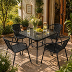 Load image into Gallery viewer, 5-Piece Black Garden Dining Set – Outdoor Table with Tempered Glass Top &amp; 4 Designer Chairs, Weather-Resistant Patio, Balcony &amp; Terrace Furniture**