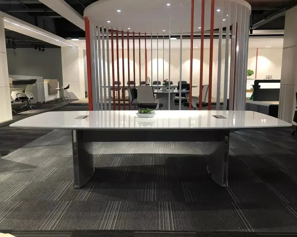Modern white executive conference table with sleek metallic legs and minimalist design for luxury office meetings