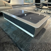 Luxury modern executive coffee table with a sleek silver metallic frame and dark glossy glass top 140 x 70 x 45 cm