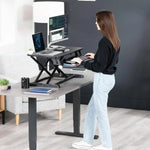 Load image into Gallery viewer, NEWSTAR 32 inch Desk Converter, K Series, Height Adjustable Sit to Stand Riser, Dual Monitor and Laptop Workstation with Wide Keyboard Tray, Black