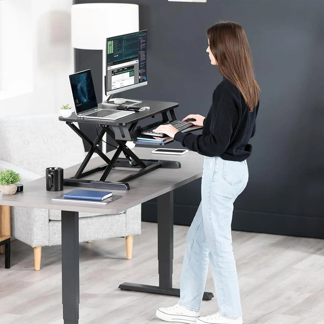 NEWSTAR 32 inch Desk Converter, K Series, Height Adjustable Sit to Stand Riser, Dual Monitor and Laptop Workstation with Wide Keyboard Tray, Black